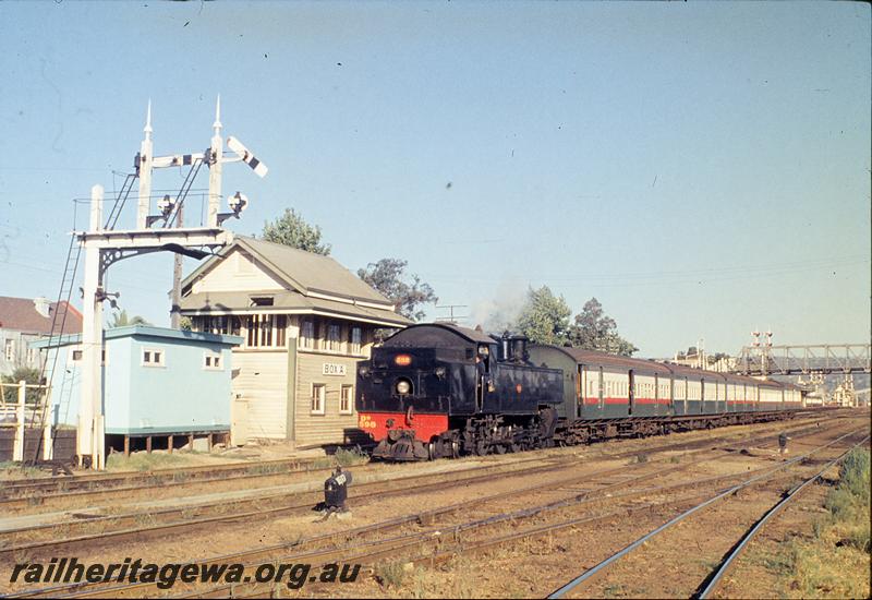 P11875
DD class 598, up suburban passenger, signals, signal box, footbridge in background, departing Midland Junction. ER line.
