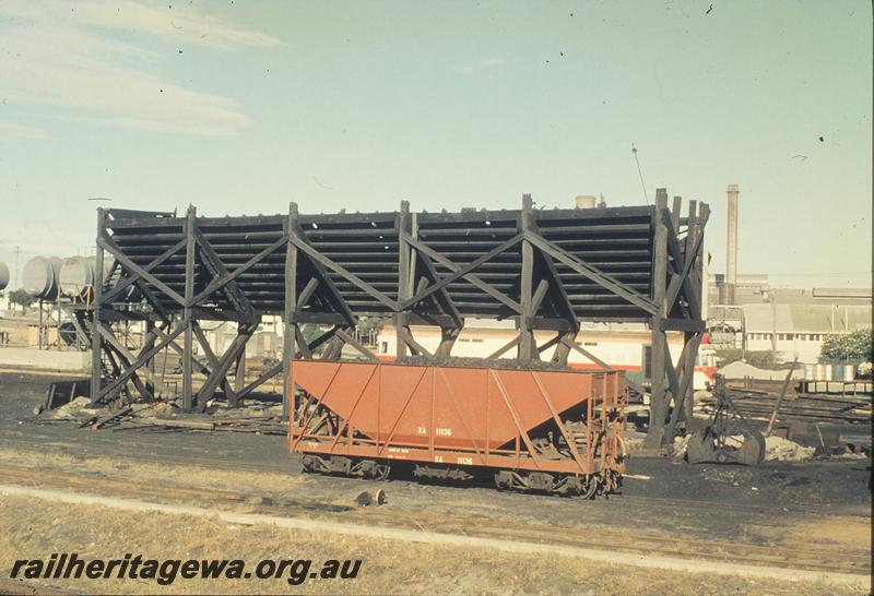 P11894
Coal stage partially demolished, XA class 11136 coal wagon in foreground, East Perth loco shed. ER line.
