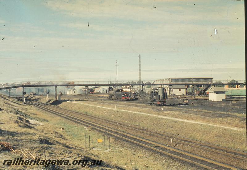 P11896
East Perth loco shed, demolition preparations, Summer St footbridge, FS class, steam grab crane in foreground. ER line.
