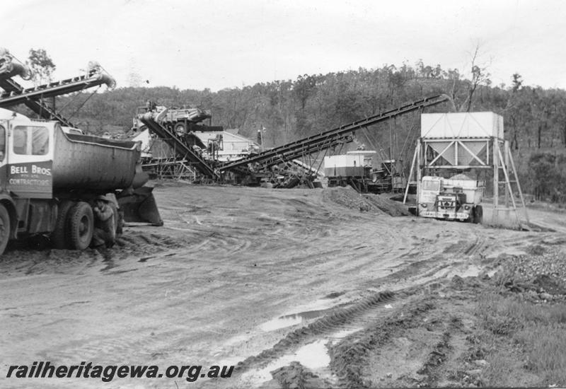 P12033
11 of 12 images of the construction of the Kwinana to Jarrahdale railway. (ref: The Railway Institute Magazine, July 1963). Ballast being crushed at a mobile crushing plant
