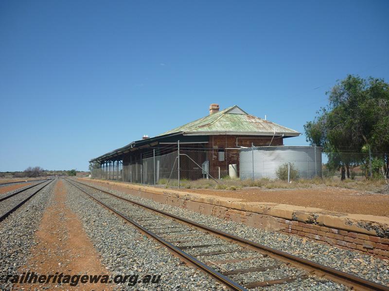 P12053
1 of 9 views of the station building at Menzies, KL line, disused and fenced off to the public, north end and trackside view
