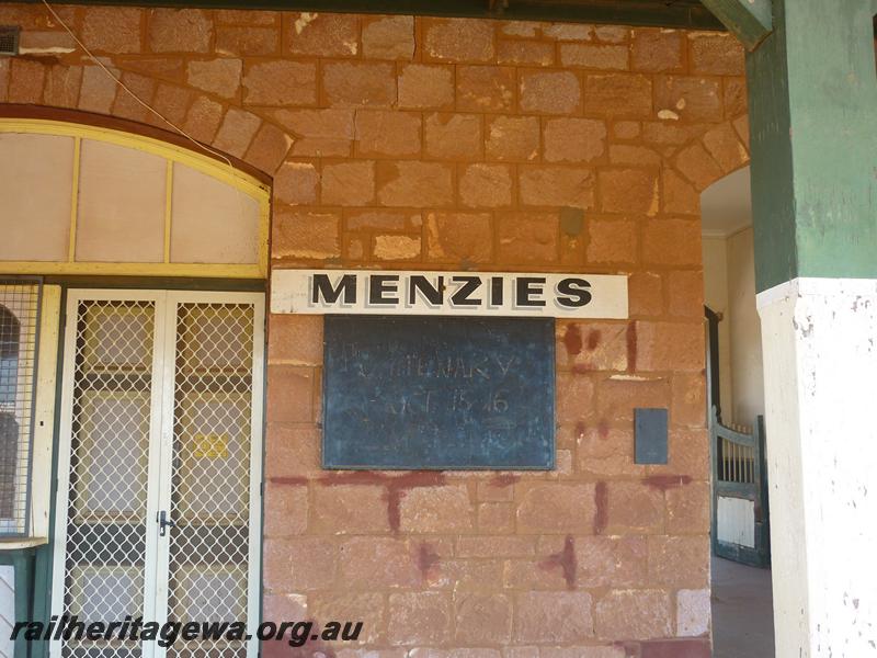 P12059
7 of 9 views of the station building at Menzies, KL line, disused and fenced off to the public, station nameboard with shadowed lettering
