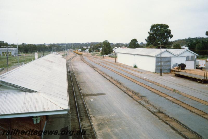 P12089
Station building, goods shed, yard, Narrogin, GSR line, elevated view looking south
