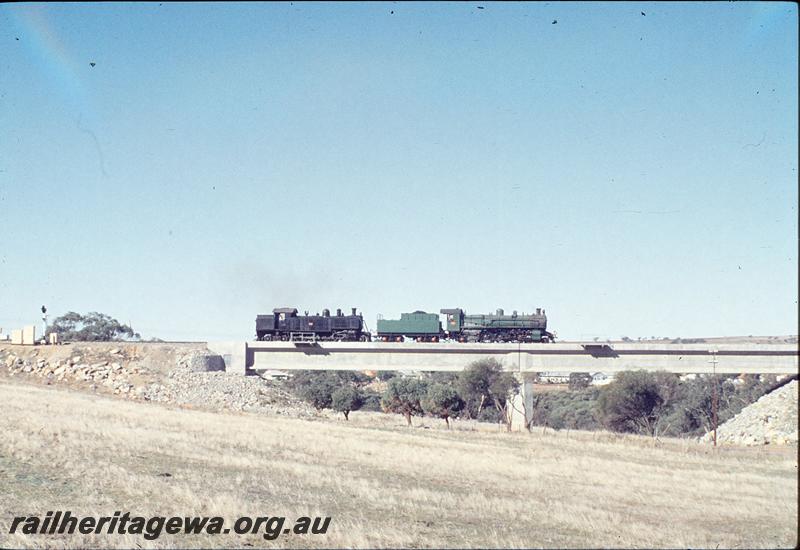 P12128
PM class 701, DD class 593, on deviation bridges, West Northam. Delivery of DD to old Northam loco. ER line.
