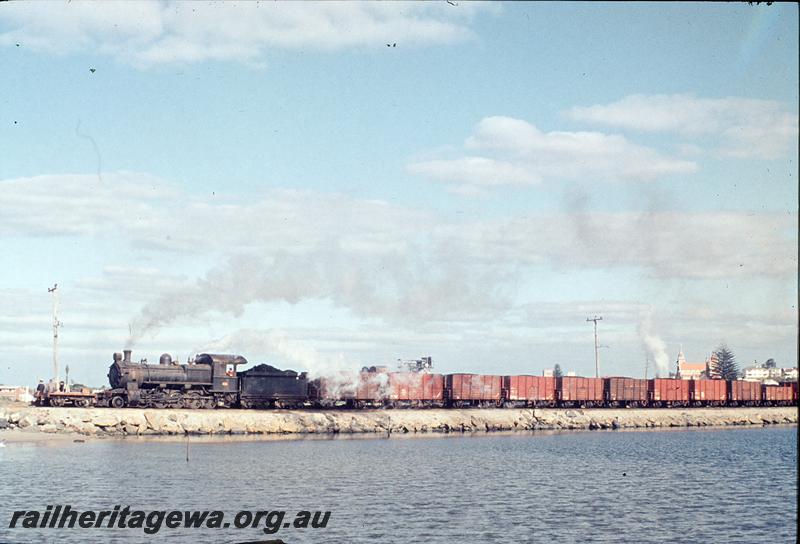 P12184
FS class 454, 1600 ton coal train for Bunbury Powerhouse crossing the plug, W assisting in rear out of sight, Bunbury. SWR line.
