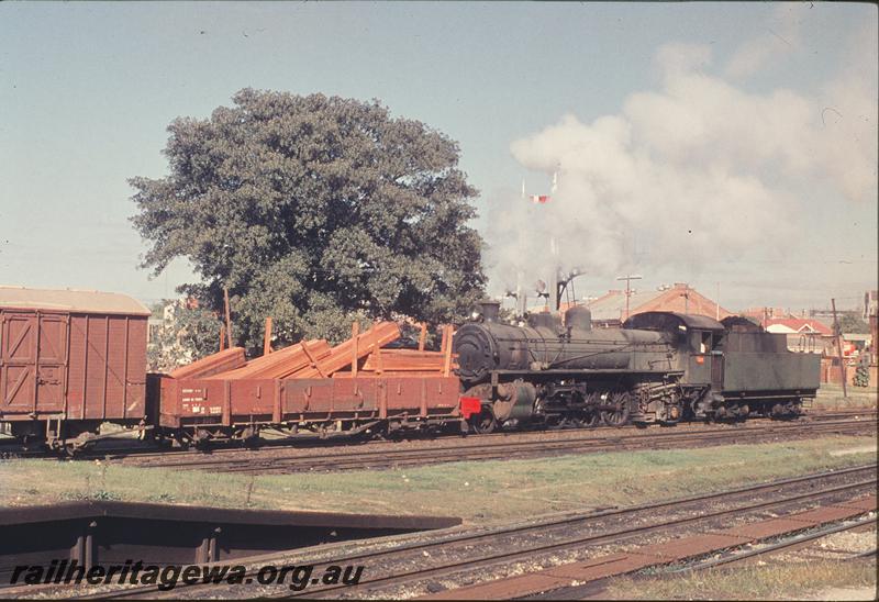 P12203
PMR class 728, shunting at East Perth, R class 3391 bogie open wagon with timber load coupled to the loco. East Perth, ER line.
