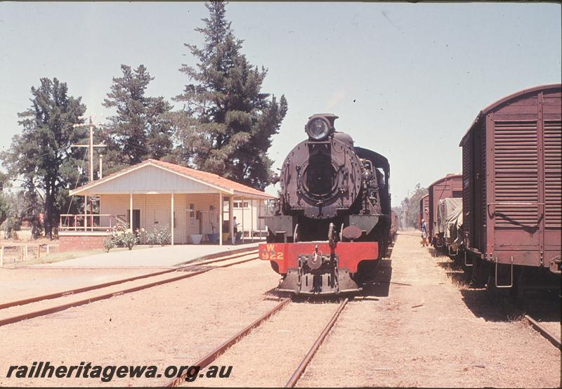 P12388
W class 922, 193 goods, arriving Dwellingup with second part of train, station building, platform. PN line.
