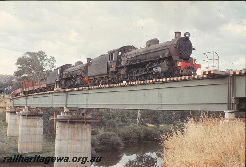 P12420
W class 937, W class 917, ballast train on steel girder bridge, Bridgetown, PP line. Additional wagons including stock wagon for brake power.
