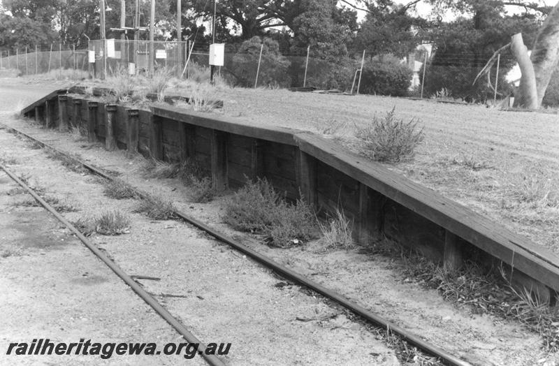 P12600
Loading platform, Armadale, SWR line, overgrown and out of use, trackside and end view.
