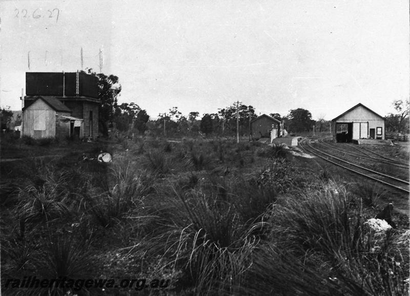 P12616
Water tower with enclosed stand, station building, goods shed, Serpentine, SWR line, overall view of the station precinct looking south
