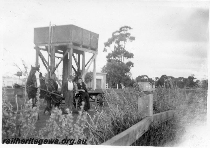 P12637
Water tower, Moora, MR line, Bill Medbury and Des Murray, Carriers with hose and cart in front of tower, 
