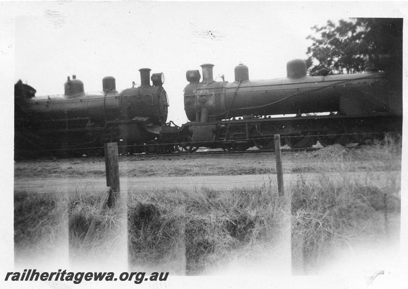 P12641
1 of 4 views of the head on collision of two trains hauled by D class 19 and A class 25 at Gingin, MR line, side view of the locos in contact with each other.
