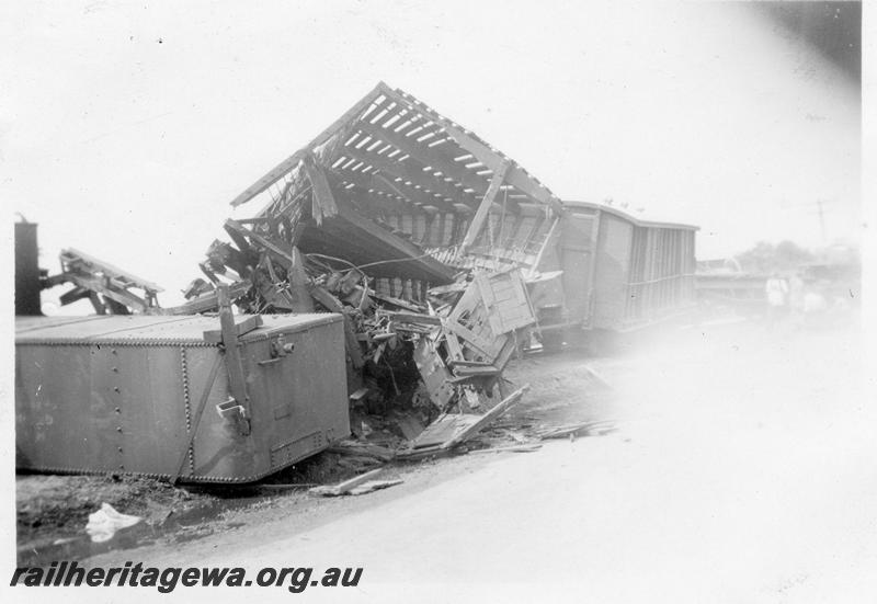 P12644
4 of 4 views of the head on collision of two trains at Gingin, MR line, view shows the body of a square water tank wagon and a wrecked sheep wagon
