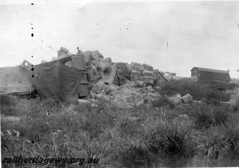 P12647
3 of 7 views of the derailment at Millendon on the 22nd December 1944, MR line, views shows bales of hay spilled from the derailed wagons
