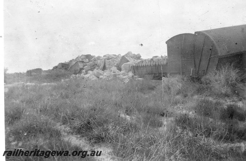 P12648
4 of 7 views of the derailment at Millendon on the 22nd December 1944, MR line, view shows bales of hat spilled from the derailed wagons
