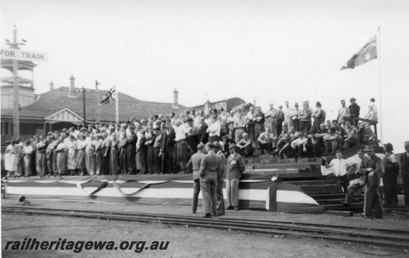 P12657
Crowd waiting for the Queen to arrive in Midland Junction, view shows the MRWA line that crosses the junction of Great Eastern Highway and Helens Street. 
