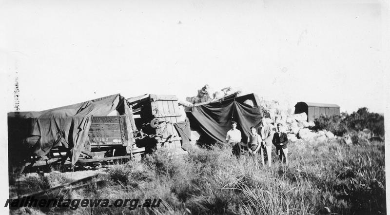 P12660
2 of 3 views of the derailment at Muchea, MR line, row of derailed wagons, row of derailed wagons including MRWA AC class 152
