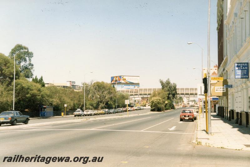 P12665
The overpass from Raine Square to the Perth Bus station, view looking east along Wellington Street. The advertising tower at the corner of Wellington Street and the 