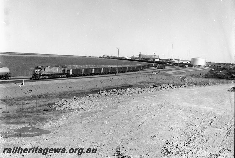 P12689
Port Hedland, Mount Newman Mining's Nelson Point yard view with empty train and M636 class 5454
