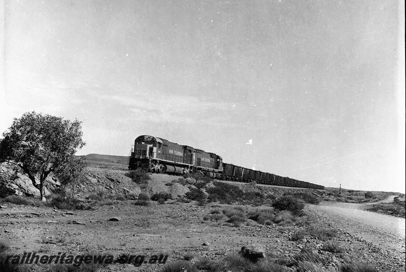 P12691
Hamersley Iron M363 class 4030 and a C636 with a loaded train in the Chichester Range
