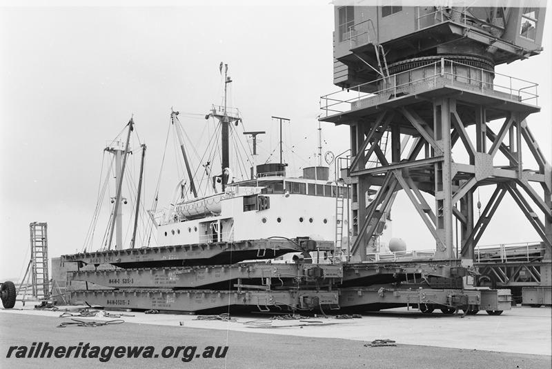 P12692
The new Cape Lambert service wharf with M-K-M-O, lettered for the builders of the Robe River railway, flat wagons
