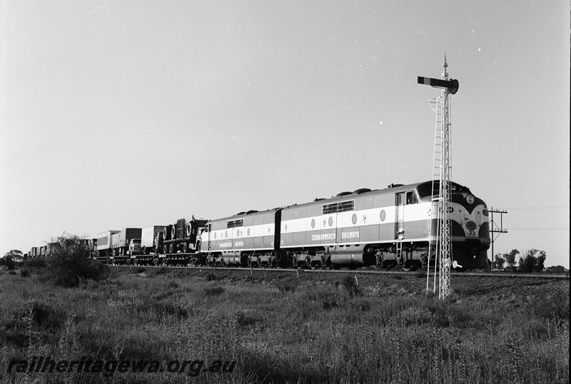 P12701
Commonwealth Railways (CR) GM class 23 double heading with GM class 21, lattice pole signal, freight train
