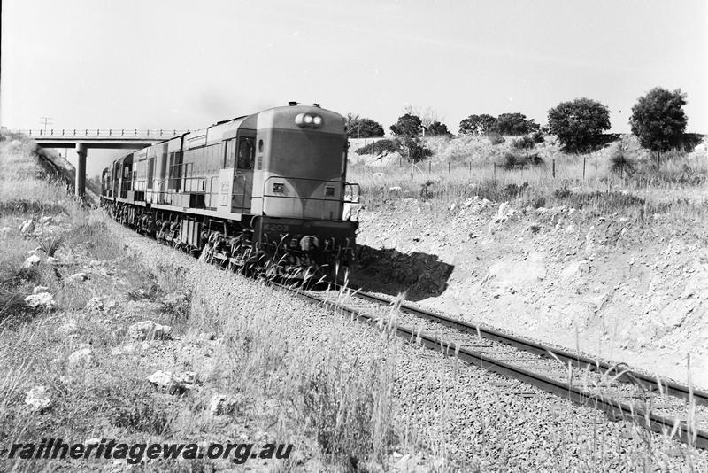 P12714
K class 203 in original livery leading three other locos going under a road overbridge.
