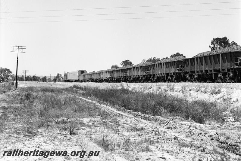 P12717
Loaded WO class iron ore wagons on train with a crew car at the end of the train.
