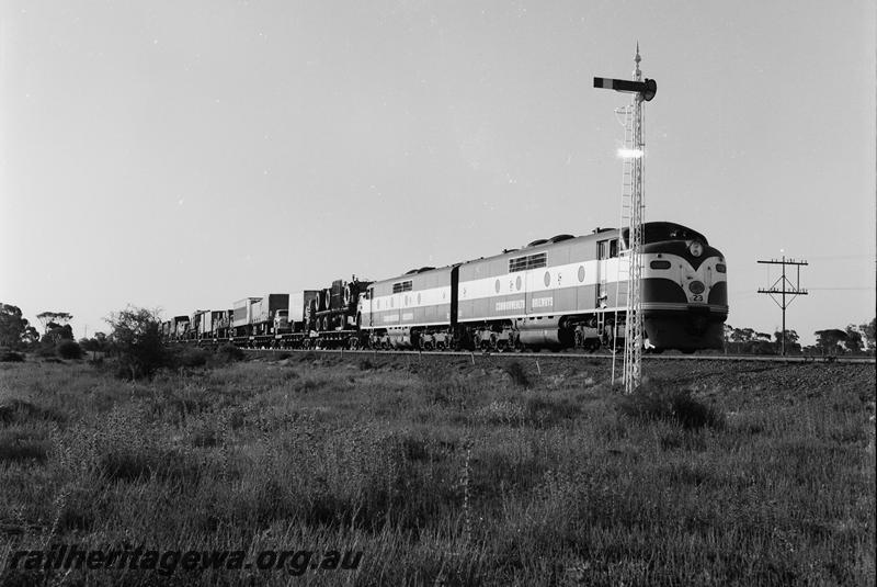 P12719
Commonwealth Railways (CR) GM class 23 and GM class 21, lattice pole signal, freight train
