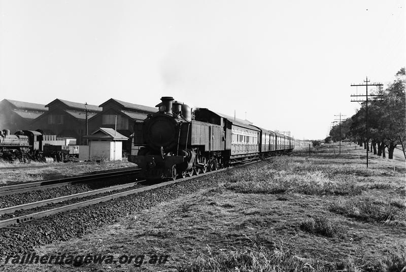 P12734
DD class593, on suburban passenger working passing the East Perth loco sheds heading towards Midland.
