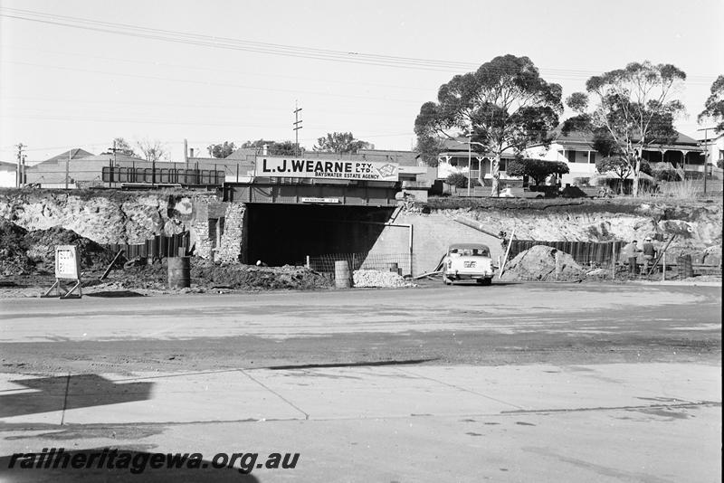 P12743
Subway, Bayswater with advert for L.J.Wearne, Bayswater Estate Agency, side view, views show progress on the new subway.
