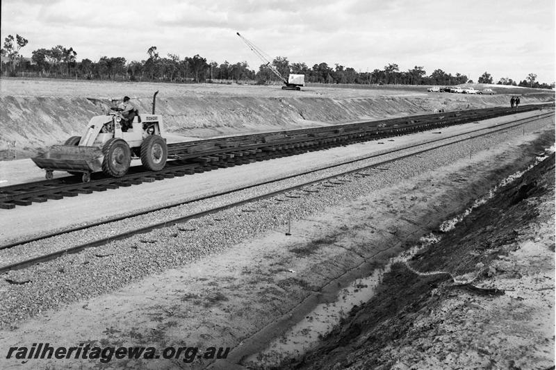 P12767
Track laying on the standard gauge, Millendon, the MR line in the foreground
