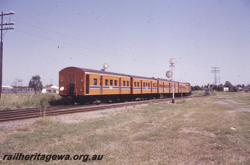 P12777
Suburban passenger carriage set, rear of searchlight signals, Midland, Royal Show working being hauled by A class 1510.
