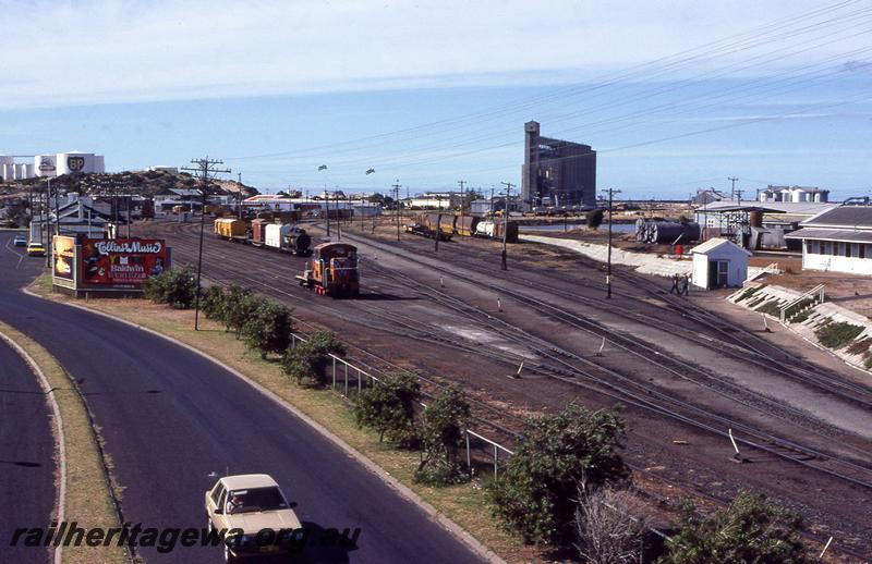 P12798
TA class loco, roundhouse, yard, pair of tanks from the JG class tank wagons in the right hand background, Bunbury, SWR line
