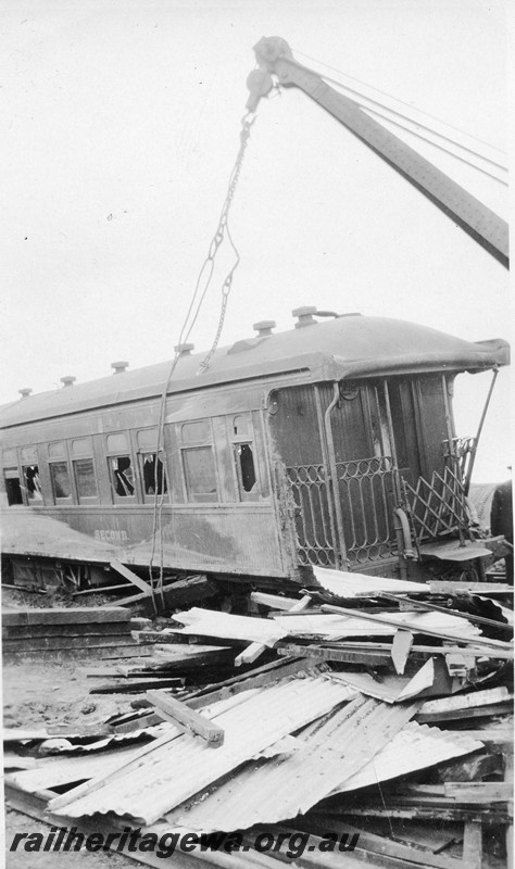 P12812
ARS class second class sleeper carriage, derailed at Korrelocking, GM line, crane lifting the carriage, debris spread around the tracks
