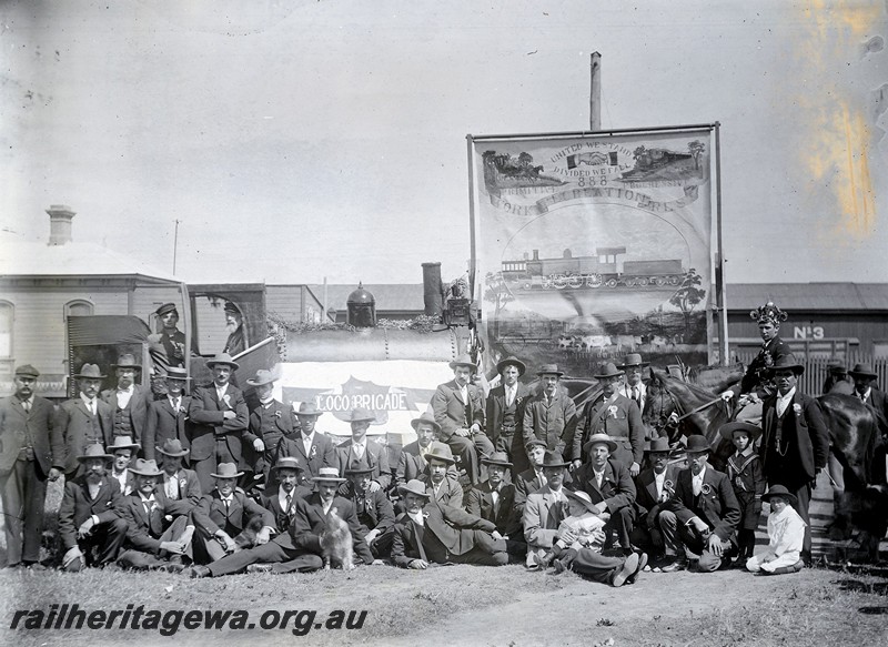 P12911
The mock up of a locomotive with the workers and their banner in preparation for the 