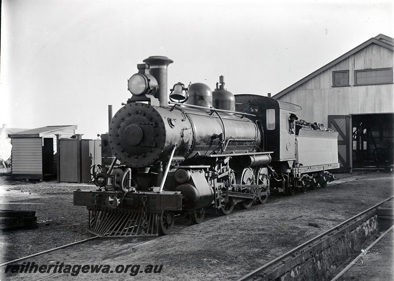 P12914
C class 267 with bell. loco shed, Geraldton, NR line, front and side view.
