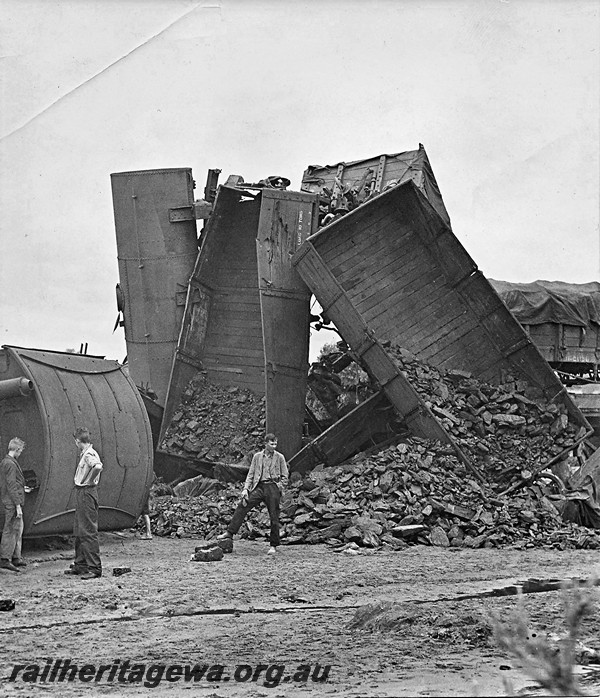 P12923
2 of 8 images of a derailment at Dumberning, BN line, derailed wagons piled up some almost vertical.Date of derailment 14/3/1934
