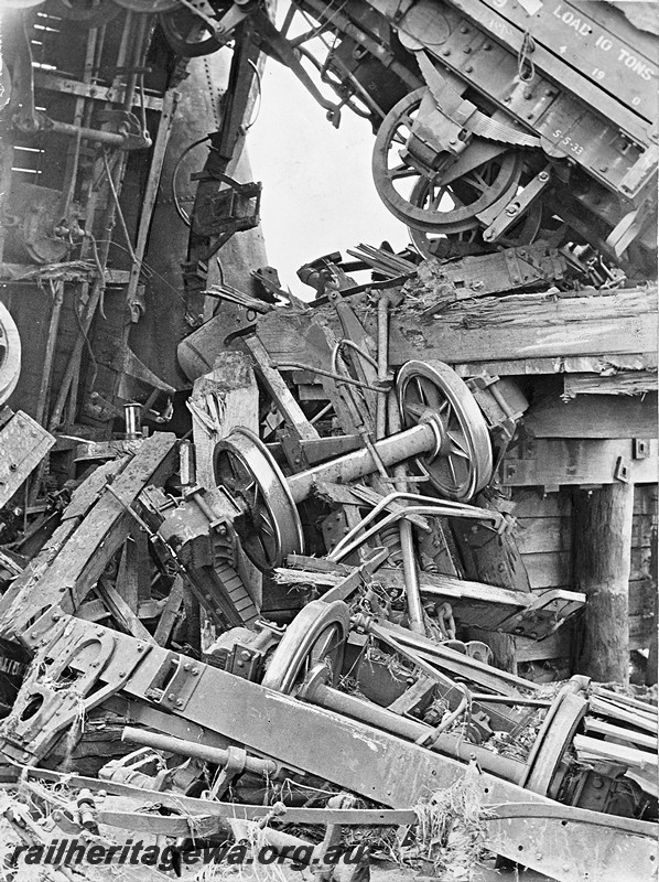 P12926
5 of 8 images of a derailment at Dumberning, BN line, a conglomeration of wheelsets, underframes and smashed wagon bodies. Date of derailment 14/3/1934
