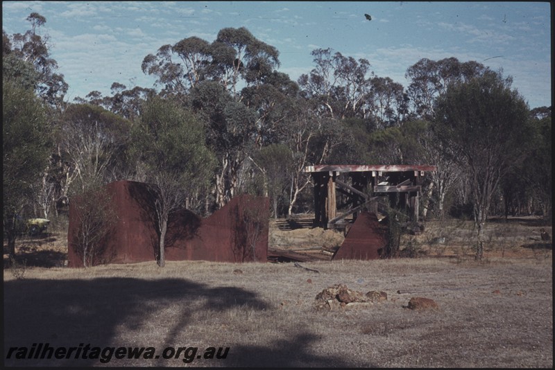 P12962
Water tank, derelict on the ground, stand in the background, Congelin, PN line.
