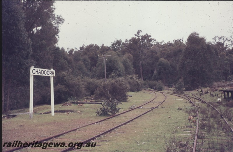 P12964
Station nameboard, siding, Chadoora, PN line, view along the siding. 
