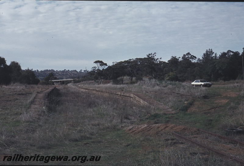 P12978
Station platforms, abandoned, Clackline, ER line, view along the right of way, road bridge in the background.
