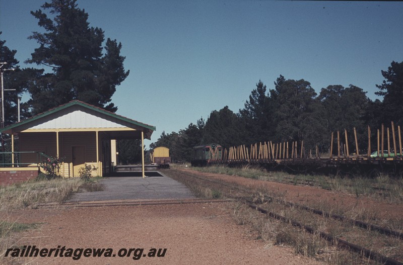 P12991
F class, station building, timber wagons, Dwellingup, PN line, end view of building.
