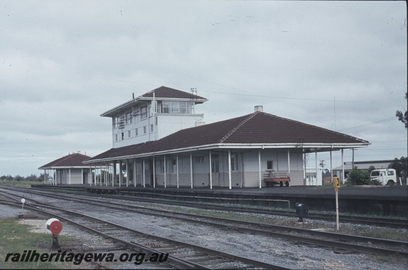 P13034
Station buildings, elevated signal box, point indicator, Brunswick Junction, SWR line, north end and east side view.
