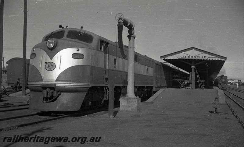 P13050
Commonwealth Railways (CR) GM class 2, water column, station building, Kalgoorlie, EGR line, front and side view. on the 