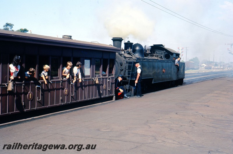 P13069
DD class 591, MRWA JA class carriage, Midland Junction Station, loco being coupled to the train to haul it into Perth, view of carriage side looking towards the loco.
