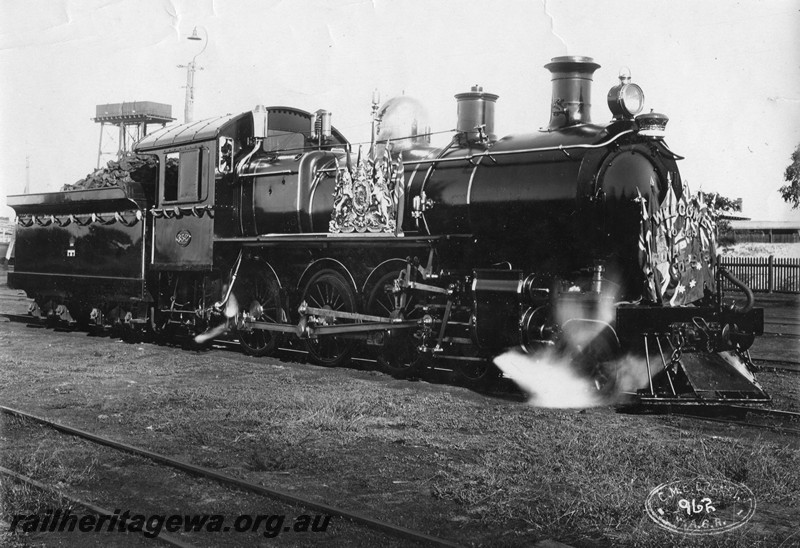 P13110
E Class 352, East Perth Loco depot, side and front view, decorated for the visit of the Duke and Duchess of York and hauled the royal train from Perth to Pinjarra and return on the 19th of May 1927, similar to P6801.
