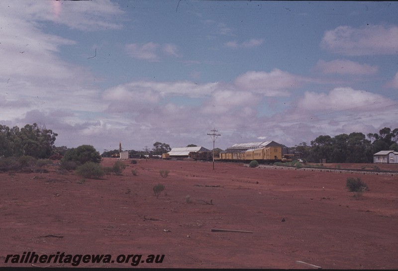 P13127
Siding with work train, Gutha, EM line, overall distant view of the siding showing the Out of Shed and wheat bins

