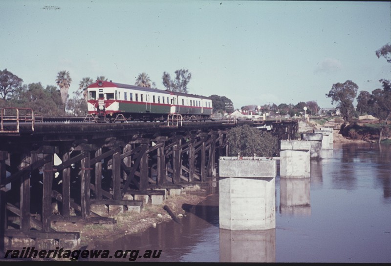 P13130
ADA/ ADG class railcar set, trestle bridges, Guildford, concrete pylons of the new bridge in the fore ground, looking west.
