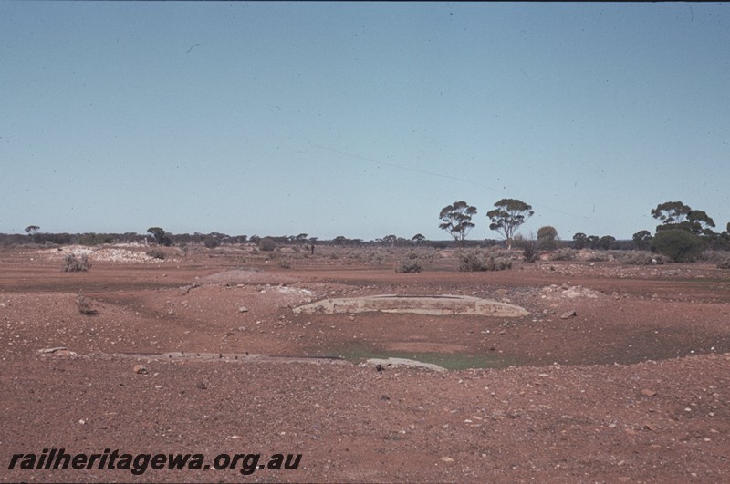 P13161
Turntable pit, Kanowna, Kalgoorlie to Kanowna line, the 50 foot turntable having been removed, view along the line of the abutments
